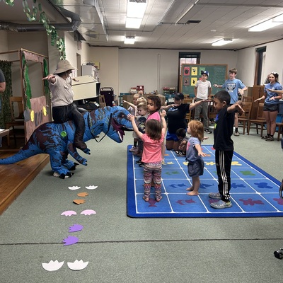 Deena the Dino and director lead summer reading program