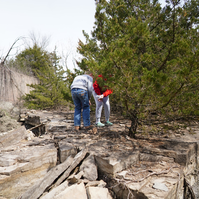 Helping each other find fossils in the rocks.