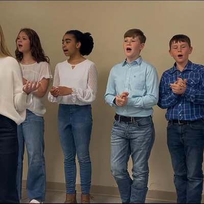 Youth choir sings at the Community Blue Building